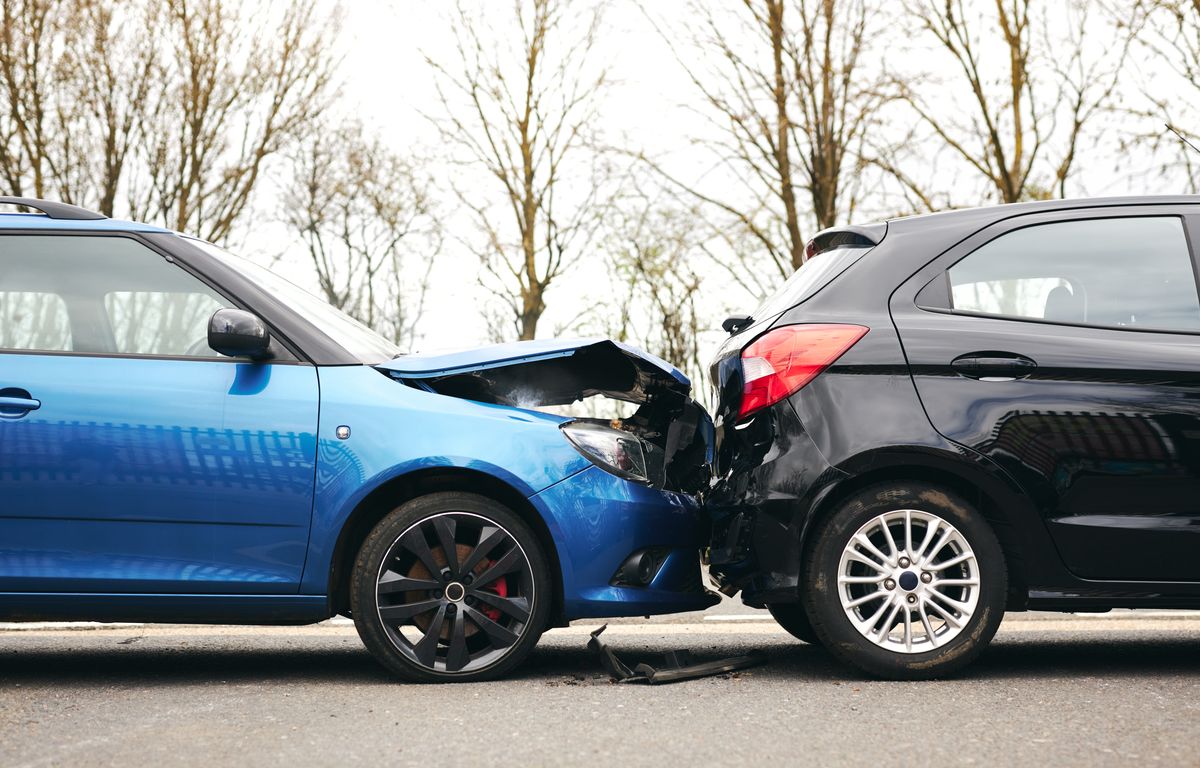 Rear end collision between two vehicles with visible front end damage